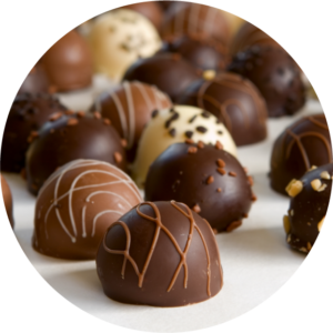 chocolate truffle background - focus on front truffle