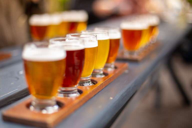 good taste beermixed alcoholic drinks on a tray