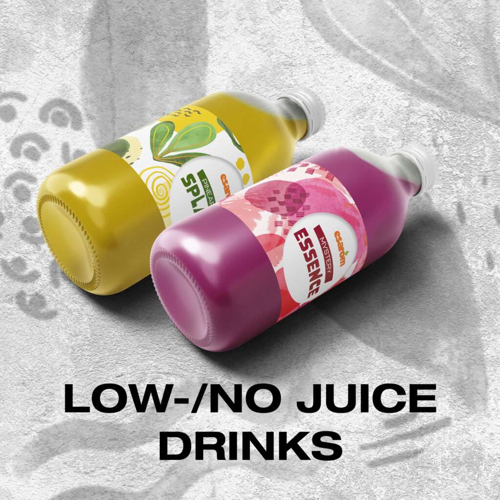 Two colorful bottles labeled “Splush” (yellow) and “Essence” (pink purple) are lying on a textured gray surface at prosweets, with the text “LOW /NO JUICE DRINKS” in bold black letters below them.