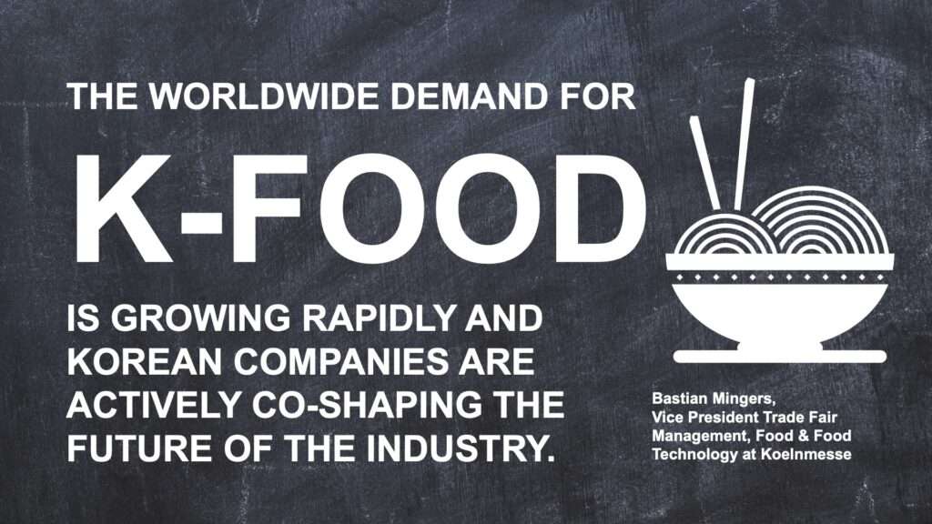 Text on a chalkboard background reads: “The worldwide demand for K Food and its unique flavours is growing rapidly, with Korean companies actively co shaping the future of the industry.” Next to the text is a bowl of noodles with chopsticks.