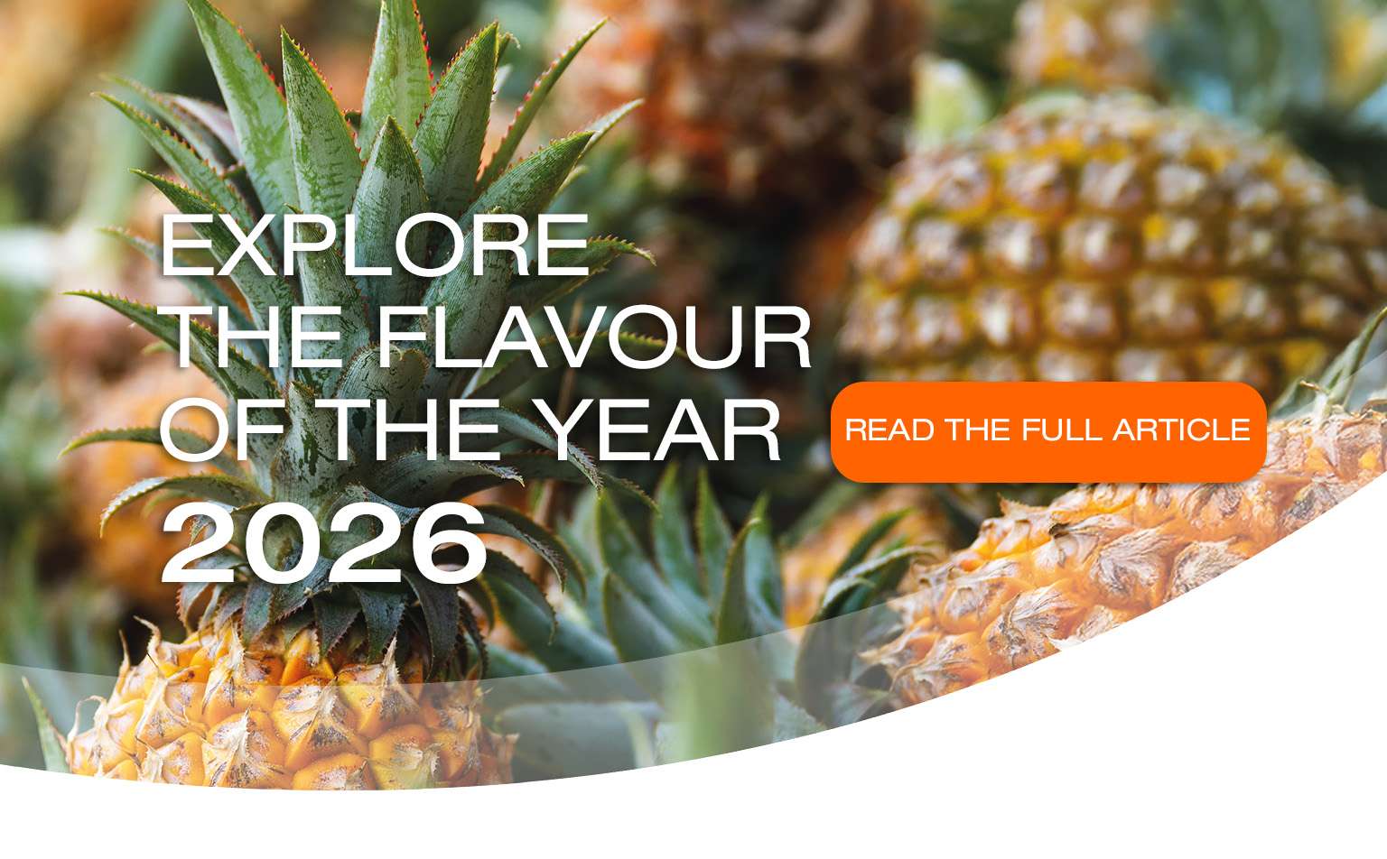 Close-up of ripe pineapples with the text "Explore the вкус of the year 2026" and an orange button that says "Read the full article" overlaid on the image.