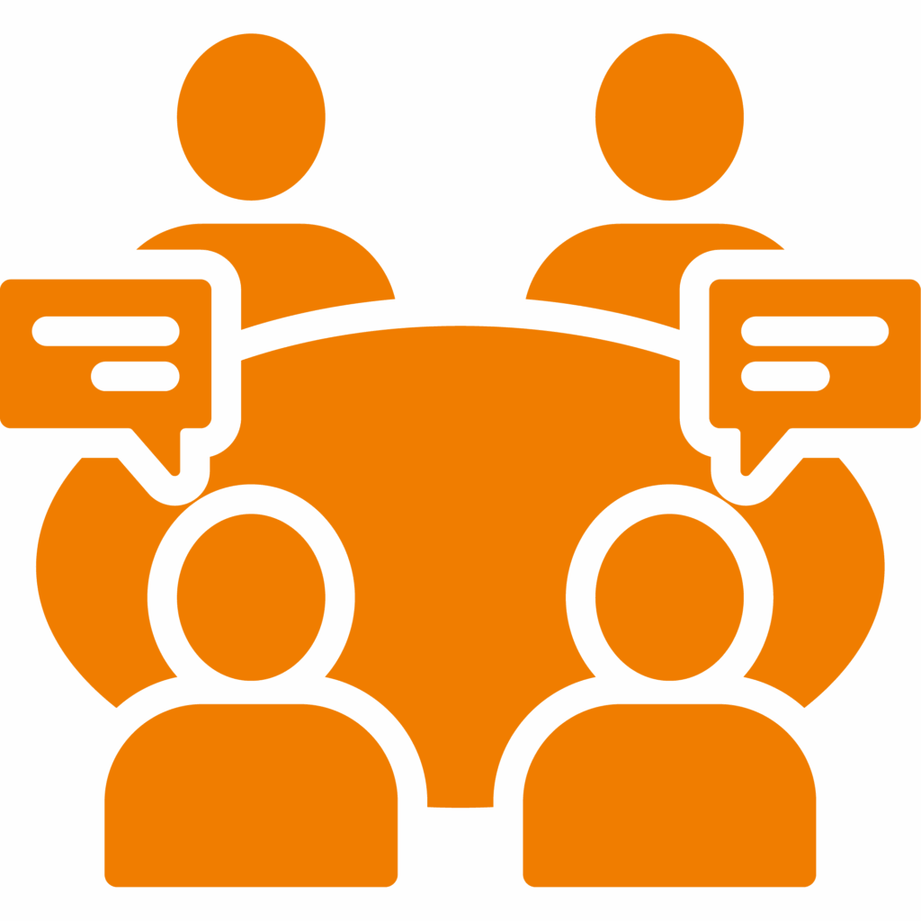 Four orange human icons sit around a circular table, each with a speech bubble, symbolizing a Produktionslogistik group discussion or meeting.