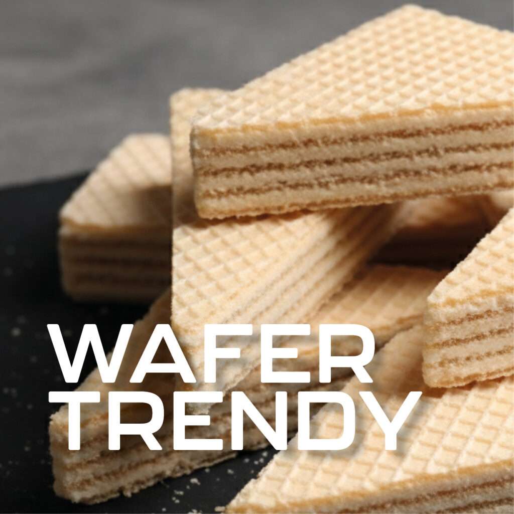 Close up of stacked cream colored wafer biscuits on a dark surface, with the words "WAFFER TRENDY" in bold white text overlaying the bottom left of the image.