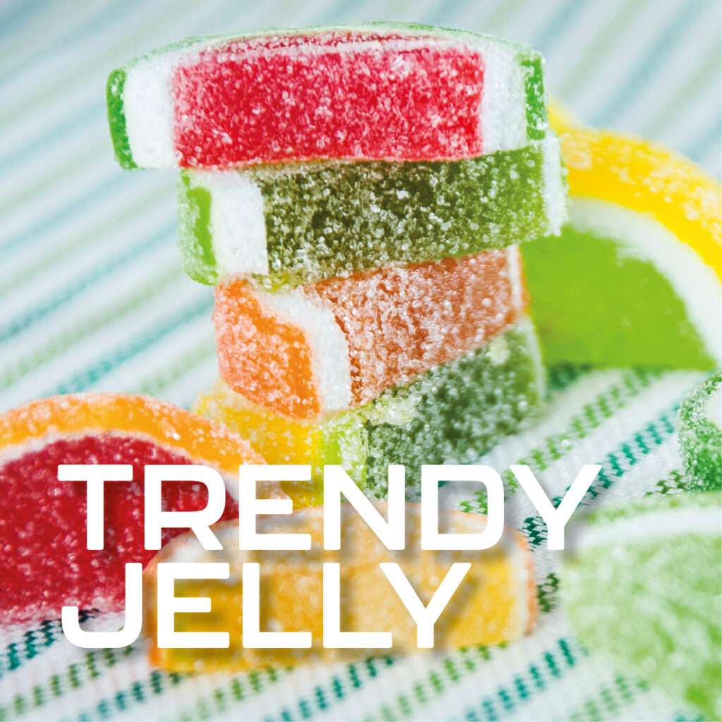 Colorful, sugar coated jelly fruit slices stacked on a striped surface, with the words "TRENDY JELLY" in bold white text at the bottom.