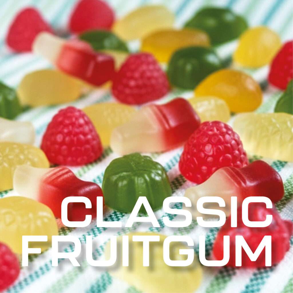 Colorful assorted fruit shaped gummy candies, including red raspberries, green and yellow shapes, scattered on a striped cloth. Bold white text at the bottom reads, “CLASSIC FRUITGUM.”.